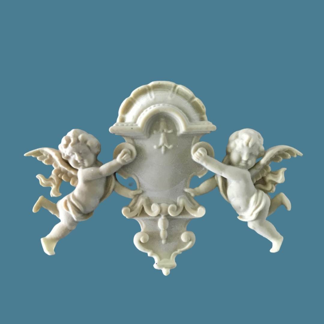 R50 Chic Cherub Onlay, an Efex flexible moulding applique of two winged cherubs holding a shell-topped shield cartouche