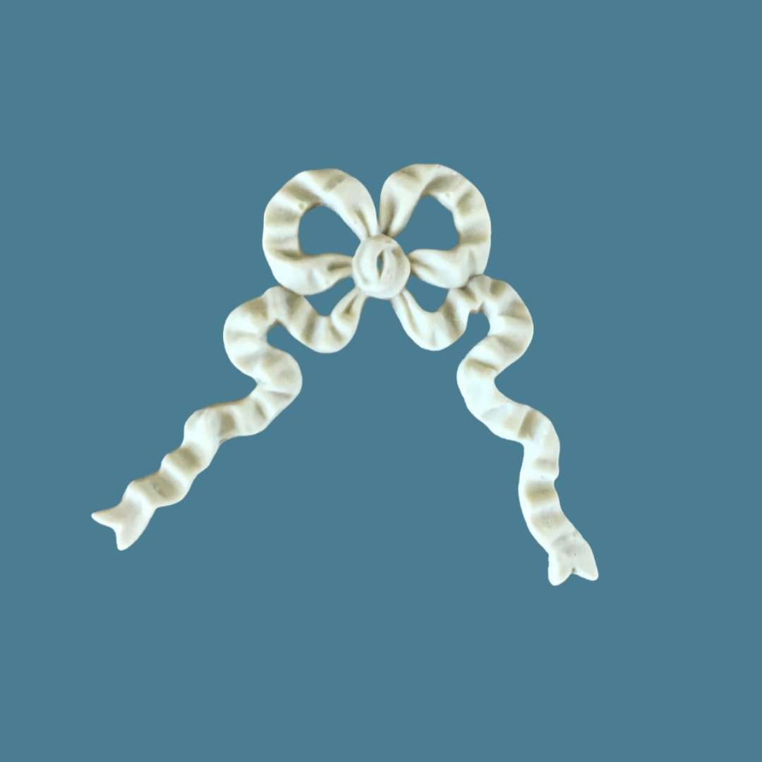 B12 Ribbon Bow, an Efex flexible moulding bow with ribbed loops and two long twisting ribbon tails hanging down