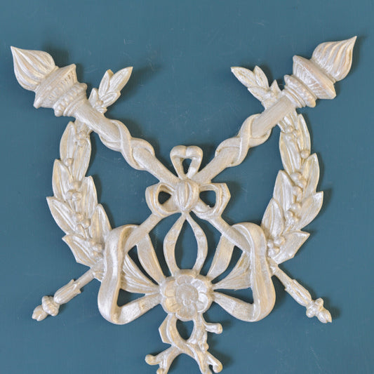 M1 French Medallion, an Efex flexible moulding of crossed flaming torches with laurel sprays and a looping ribbon bow around a central flower
