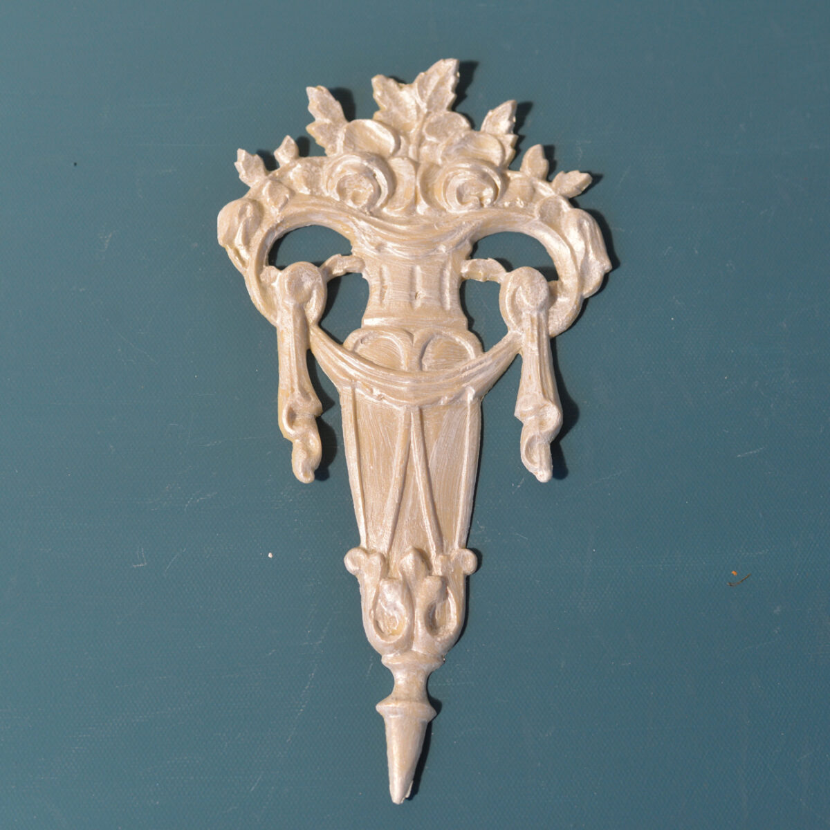 R30 Empire Style Onlay, a tall Efex flexible moulding applique of a flower-filled basket with draped swags and tassels on a tapering spire