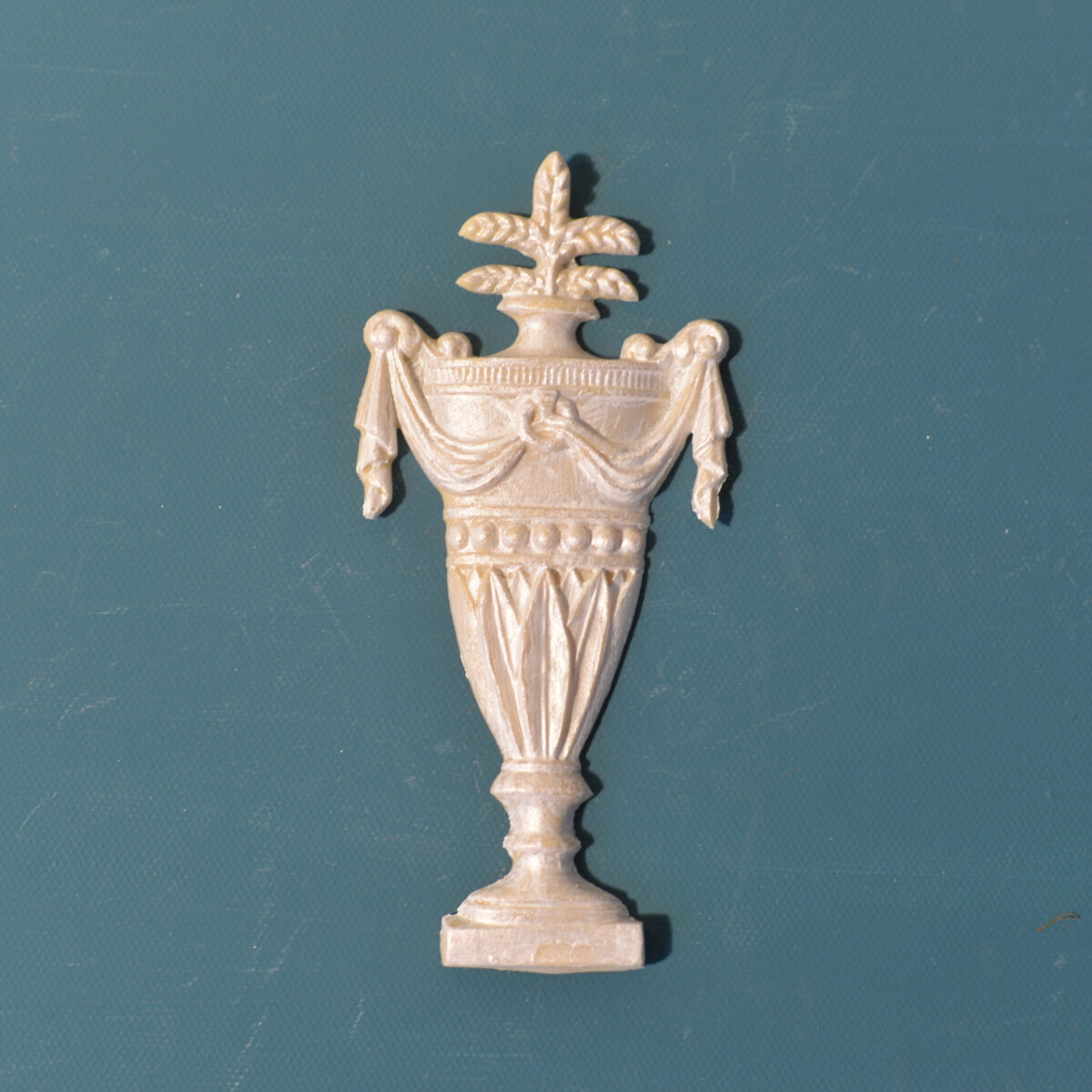 R39 Tall Urn, a slender neoclassical Efex flexible moulding urn draped with swags and topped with wheat sprays, on a square pedestal
