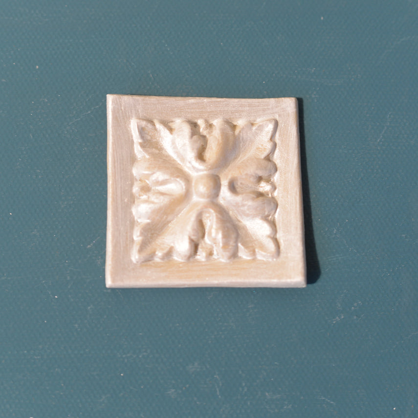 R108 Square Floral Rosette, a framed square Efex flexible moulding block with a carved four-leaf flower, for furniture corners and door panels