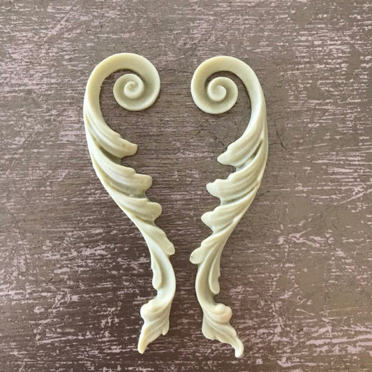 SC16 French Empire Scrolls, a mirrored pair of slender Efex flexible moulding acanthus scrolls with spiral tops and layered leaves