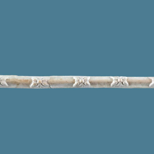 T63 Reed and Flower Efex flexible moulding trim, a slim reeded strip with small carved flower motifs spaced along its length